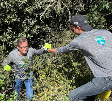 Two men work on Impact Day 2022